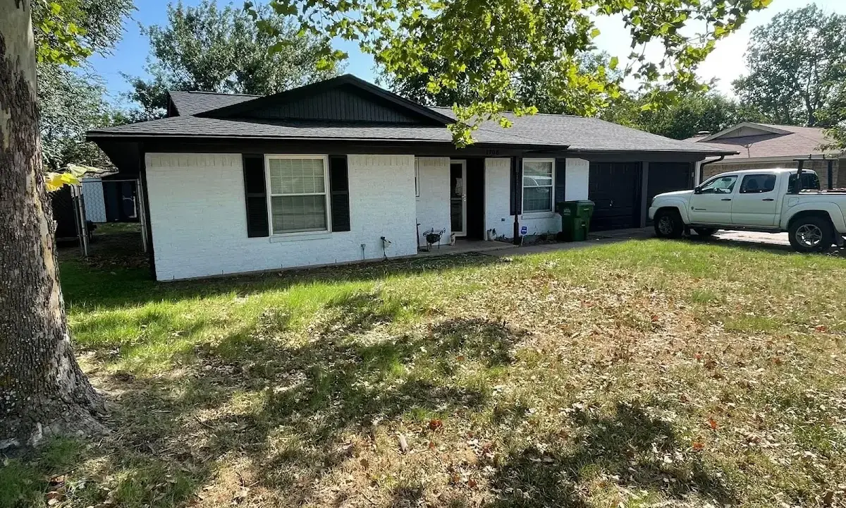 Professional roofing crew working on a residential roof in Oshkosh